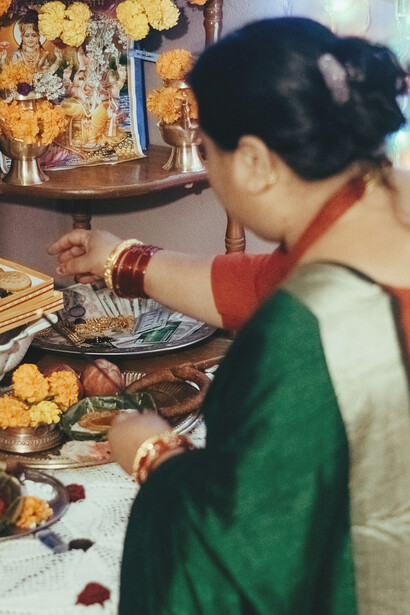 Lakshmi Puja is celebrated during Tihar, Nepal's second national festival after Dashain, which lasts five days and features Kag (crow) Tihar, Kukur (dog) Tihar, and Gai (cow) Tihar by day, ending with Laxmi Puja at night, NepalMomos beautifully displayed on a table, showcasing a popular Nepali dish
