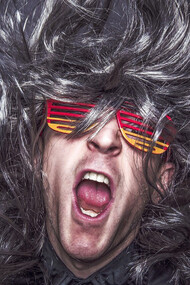 Musician wearing colorful glasses