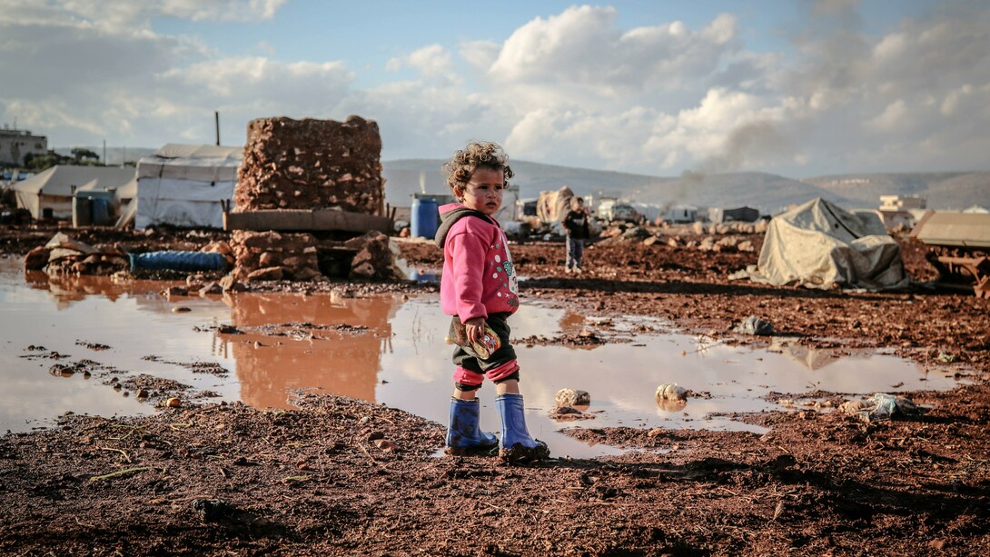 A child, who lives in poverty, stood alone by a puddle. Re-editing failed revolutions and ideologies is an understandable practice because of the permanence of oppression and inequality