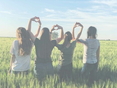 Friends united hand-in-hand in the cause to achieve self-love no matter how difficult the journey might be