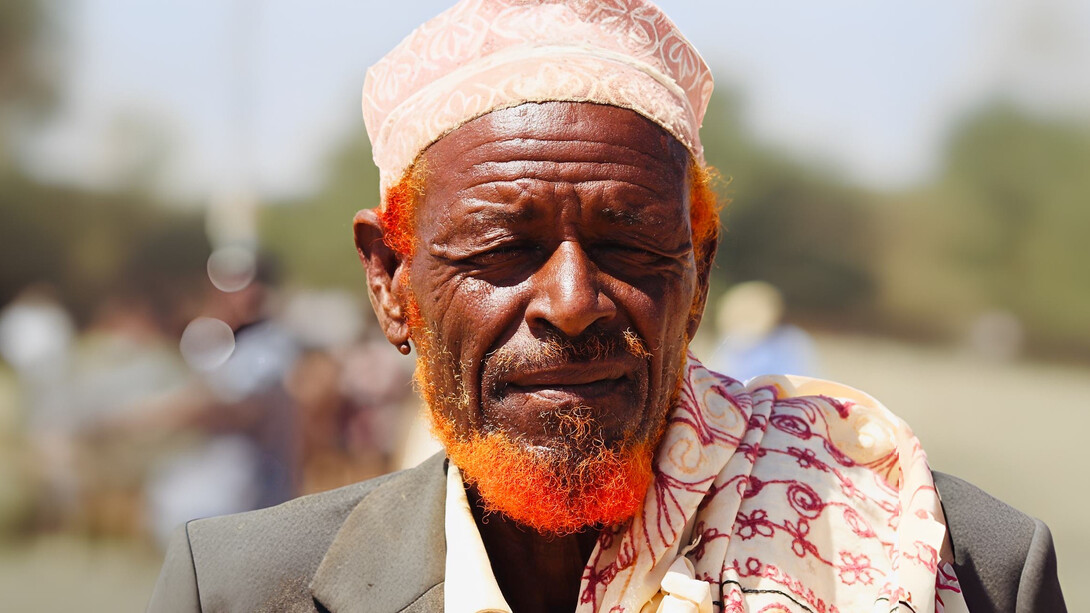The wrinkles on this elder's face tell a story of years lived with wisdom, a living testament to the timeless proverbs that guide Somali life and communication