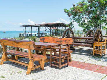 A waterfront seating area overlooking the sea, representing environmental design that supports safety and social engagement