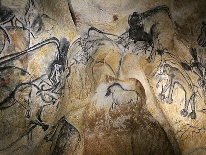 The Lions Panel (center right) in the Pont d'Arc Cave, France, features a niche with a horse surrounded by animals observing it. The artwork includes wooden charcoal drawings with fading and flint scraping