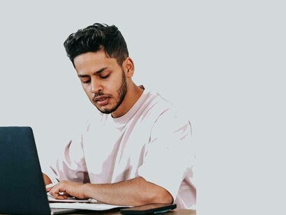 A man going through the paid search ads on his laptop