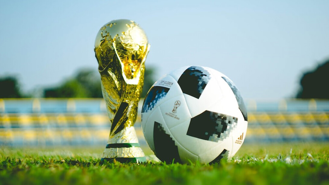 Pre-World Cup 2018,a gleaming gold trophy alongside a soccer ball, hinting at the excitement to come