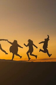 Five people jumping together