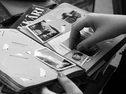 A collection of monochrome photographs from the past, reflecting the role of personal records in preserving collective memory