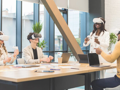 Architects at a business conference wearing VR headsets in a modern office setting