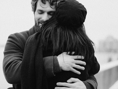 Two people hugging 
