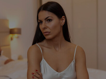 Young couple having a disagreement at home, with the woman visibly frustrated and upset