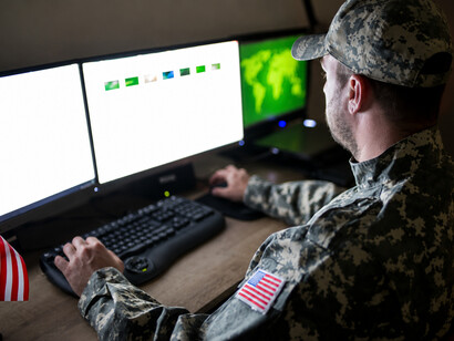 American soldiers monitoring military operations from a central command and control center
