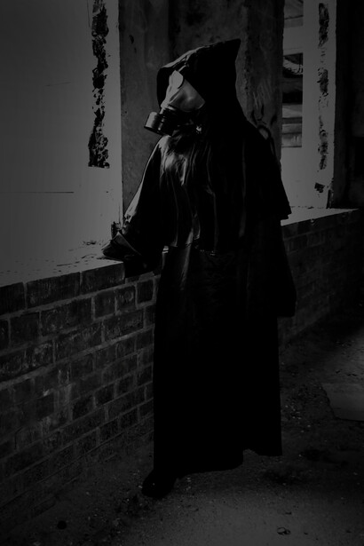 Angel of death with a gas mask looking out to the destruction of the world