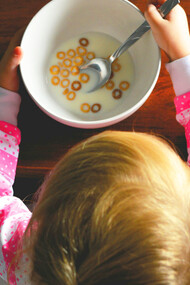 A toddler enjoying a healthy cereal; scientific research has uncovered a fascinating link between the gut and the brain, commonly referred to as the gut-brain axis