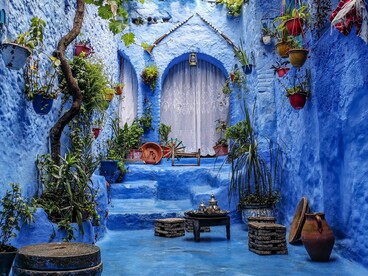 A blue courtyard in Tangier, Morocco, representing the peaceful retreat where detachment begins and the soul finds stillness