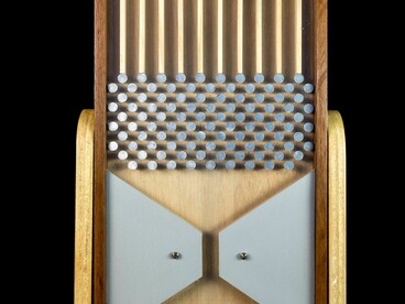 A Galton Board demonstrates how completely chaotic individual paths predictably form a normal distribution curve