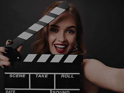 A glamorous lady, adorned in a captivating red dress, strikes an elegant pose with a clapperboard in hand, set against the dramatic backdrop of a black Hollywood star ambiance