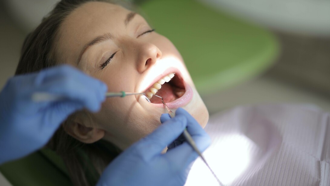 Patient having her teeth examined