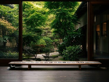 An open interior overlooking a secluded garden, reflecting the calm rhythm created through courtyard integration