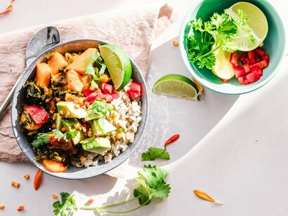 A colorful bowl packed with vegetables, herbs, and healthy ingredients, reflecting the importance of vitamins and minerals for healthy follicles