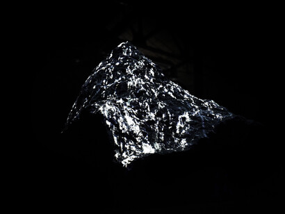Michel Comte, Light. Requiem, 2017. Mountain in black granite, HD video projection, 3D mapping, stereo 19 minutes, looped. 