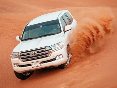 Explore the dunes of Dubai, United Arab Emirates, on an adrenaline-pumping desert safari using powerful 4x4 vehicles