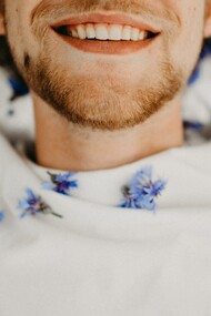 A happy man, smiling, in a good mood and good mental health condition, at peace