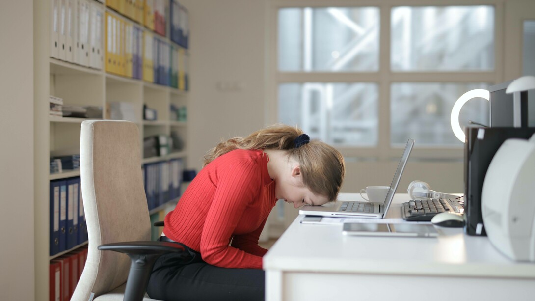 Woman asleep at her desk