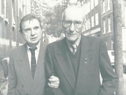 An aged William Burroughs in the arms of a loyal friend