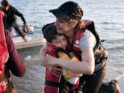 Migrantes recién salidos del mar