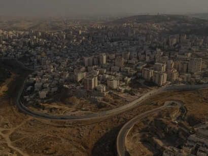 From an aerial viewpoint, the security wall stands as a physical barrier dividing Israel and Palestine