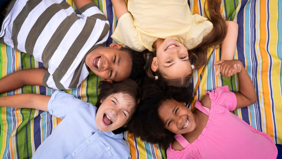 Children relaxing together on the playground