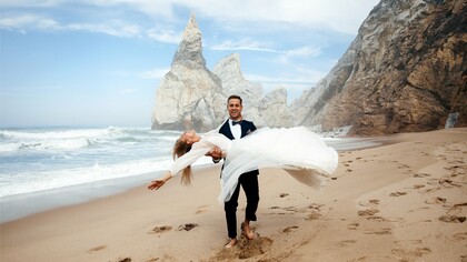 Barefoot on golden sand, this couple proves that the perfect wedding destination is wherever joy meets jaw-dropping scenery