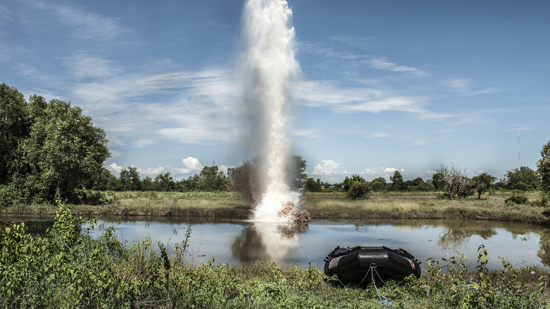 A plume of water shoots into the sky after liquid explosives are
detonated underwater. The explosives where tested to see if they
would be a viable solution to detonate UXO underwater. The test took
place at the divers training centre in Kampong Chhang Province,
Cambodia