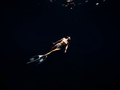 Woman diving in the ocean