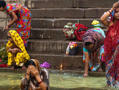 People in India cool off in the water to escape the extreme heat