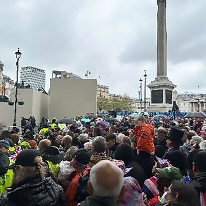 People gathering for coronation day in front of Buckingham Palace, London England