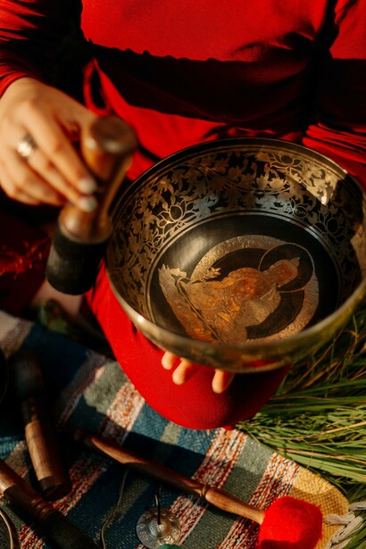 Person holding metal bowl