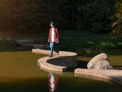 A man relaxing in nature, finding peace and experiencing spiritual awakening