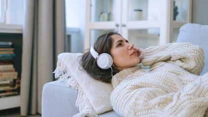 With headphones enveloping her ears, she experiences a symphony of feelings, allowing the melodies to express what words cannot
