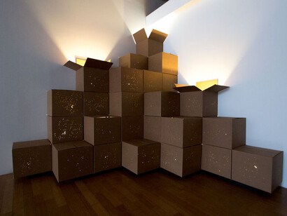 Tobias Fike, Accumulation: A Mountain of Stars cardboard boxes, electrical cord, fluorescent bulbs, painted wood base, 110 x 110 x 110 inches (279.4 x 279.4 x 279.4 cm), 2014, Installed at David B. Smith Gallery, April 2014
