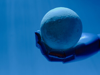 In the future, human and robot hands seamlessly collaborate, showcasing the symbiotic relationship between advancing technology and the evolving capabilities of humankind