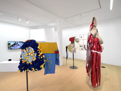 Mohamed Bourouissa, Hustling, 2015, Installation, techniques mixtes / Installation, mixed media, Dimensions variables / Variable dimensions. Costumes des chevaux par Anthony Campuzano et Kate Abercrombie en collaboration avec Mohamed Bourouissa / Horse costumes by Anthony Campuzano and Kate Abercrombie in collaboration with Mohamed Bourouissa. Horse day, 2015, Diptyque. Vidéo / Diptych. Video 13 min 28 sec. Sans titre, 2015 Installation de dessins sur papier / Installation of drawings on paper, 45 x 37 cm, Vue de l’exposition / View of the exhibition « Hustling », kamel mennour, Paris, 2015 © Mohamed Bourouissa. Photo: Julie Joubert, Courtesy the artist and kamel mennour, Paris