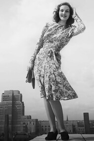 Despite restrictions on certain design elements to conserve valuable materials, wartime "austerity" fashion was far from dull, as evidenced by this vibrant purple, green, and mauve dress designed by Norman Hartnell, which cost 7 clothing coupons