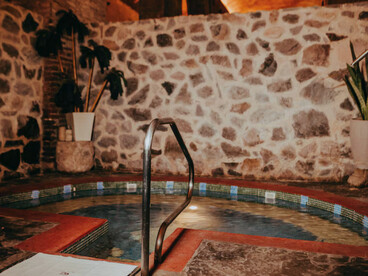 The floor is made of rough stone or concrete, slightly worn, enhancing the rustic character