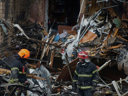 January 2, 2024, Kyiv, Ukraine: A powerful Russian missile strike has devastated a residential building in the city. Rescuers and firefighters are on the scene, aiding civilians and extinguishing the resulting fire