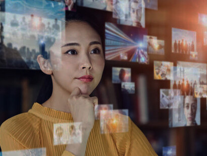 Constantly scrolling through news on her phone, a young woman comes across political deepfakes, AI-generated misinformation, and disinformation campaigns