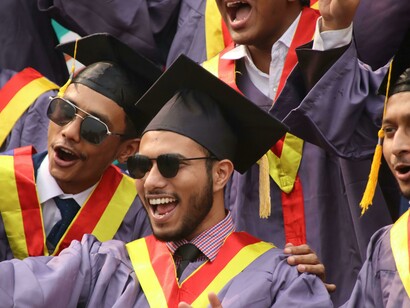 Indian graduates celebrating their convocation ceremony with joy