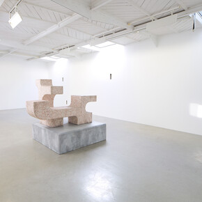 Valentin Carron - Un mur cinq trous, 2014, 5 arrow loopholes, concrete, painting, wood, Variable dimensions - Ravage with granite (after André Tommasini), 2014, Polystyrene and resin, 147 x 162 x 130 cm, View of the exhibition « L’autoroute du soleil à minuit », kamel mennour (47, rue Saint-André des Arts), Paris, 2015 © Valentin Carron, Photo: Fabrice Seixas, Courtesy the artist and kamel mennour, Paris