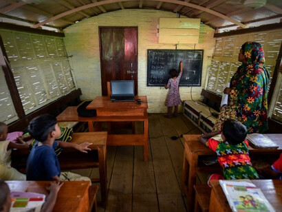 Floating schools in Bangladesh, designed by Mohammed Rezwan, are protected from the monsoon by bamboo roofs and walls, provide space for classrooms, libraries, a medical clinic and play areas