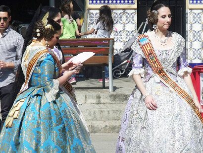 Regional costumes worn during Valencia's festivals blend historical influences with contemporary flair, creating a visually captivating display of local heritage, Spain